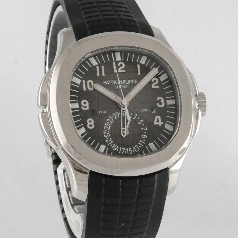 Patek Philippe · Aquanaut Travel Time — 1 / 9 Patek Philippe · Aquanaut Travel Time — 1 / 9